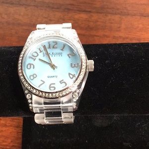 Vintage Joan Rivers stainless steel watch with clear lucite band and blue face